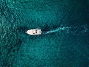 aerial view of speed boat in motion in blue sea in 2021 08 26 16 01 23 utc